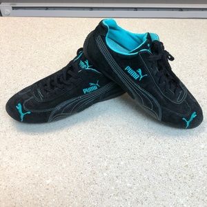 Black and teal Puma Cat Speeds size 10